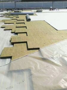 Rockwool insulation panels fully covering a concrete floor